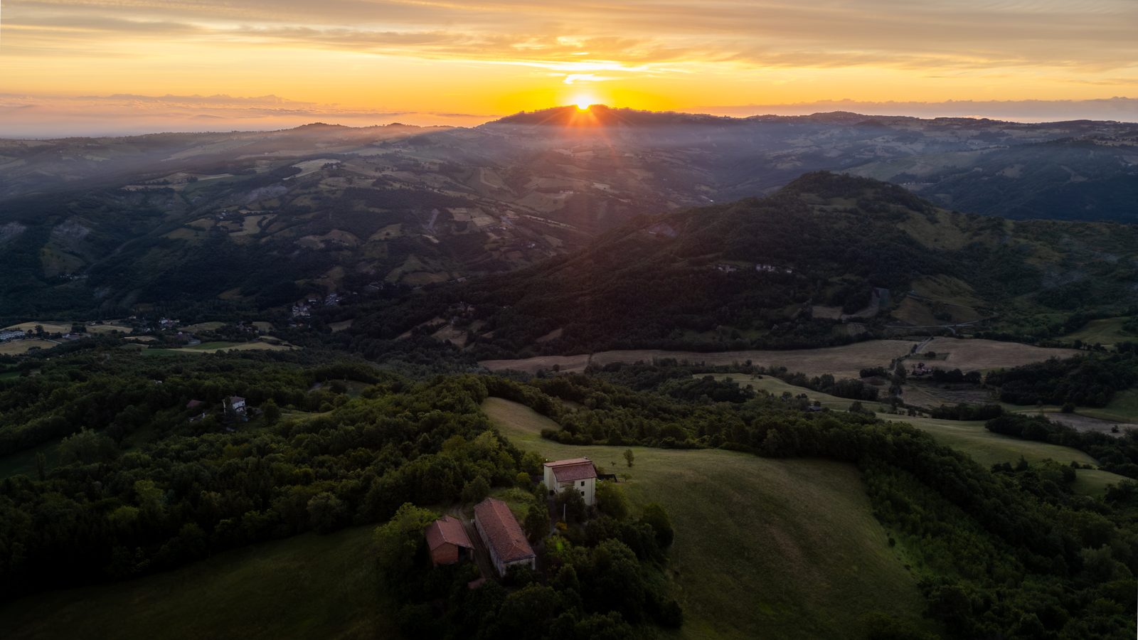 Sunrise over the San Martino valley, with Casa Lunga Nuova among the hills below