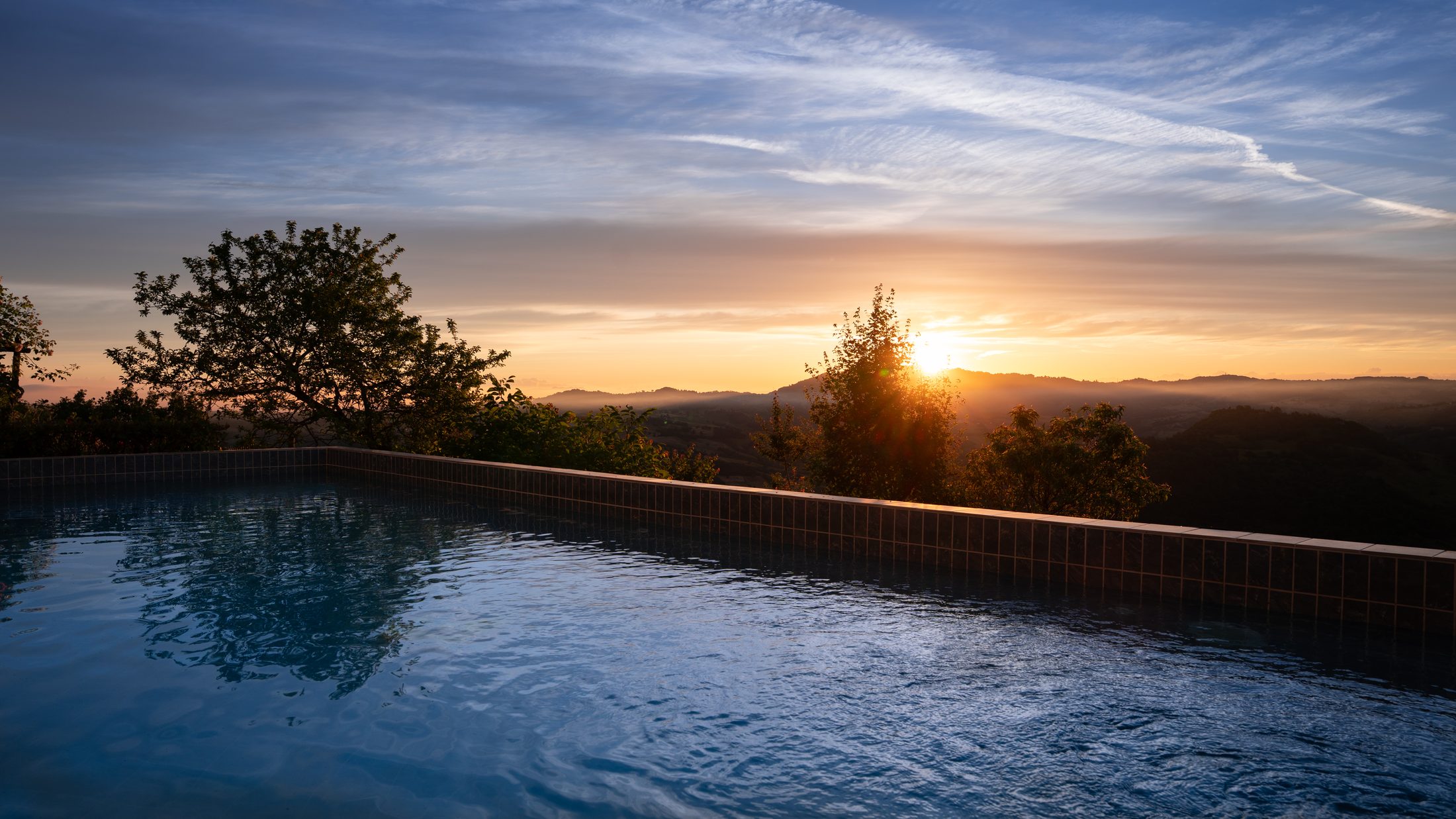 Panoramic sunrise over the Apennine hills, with neighbouring villages visible