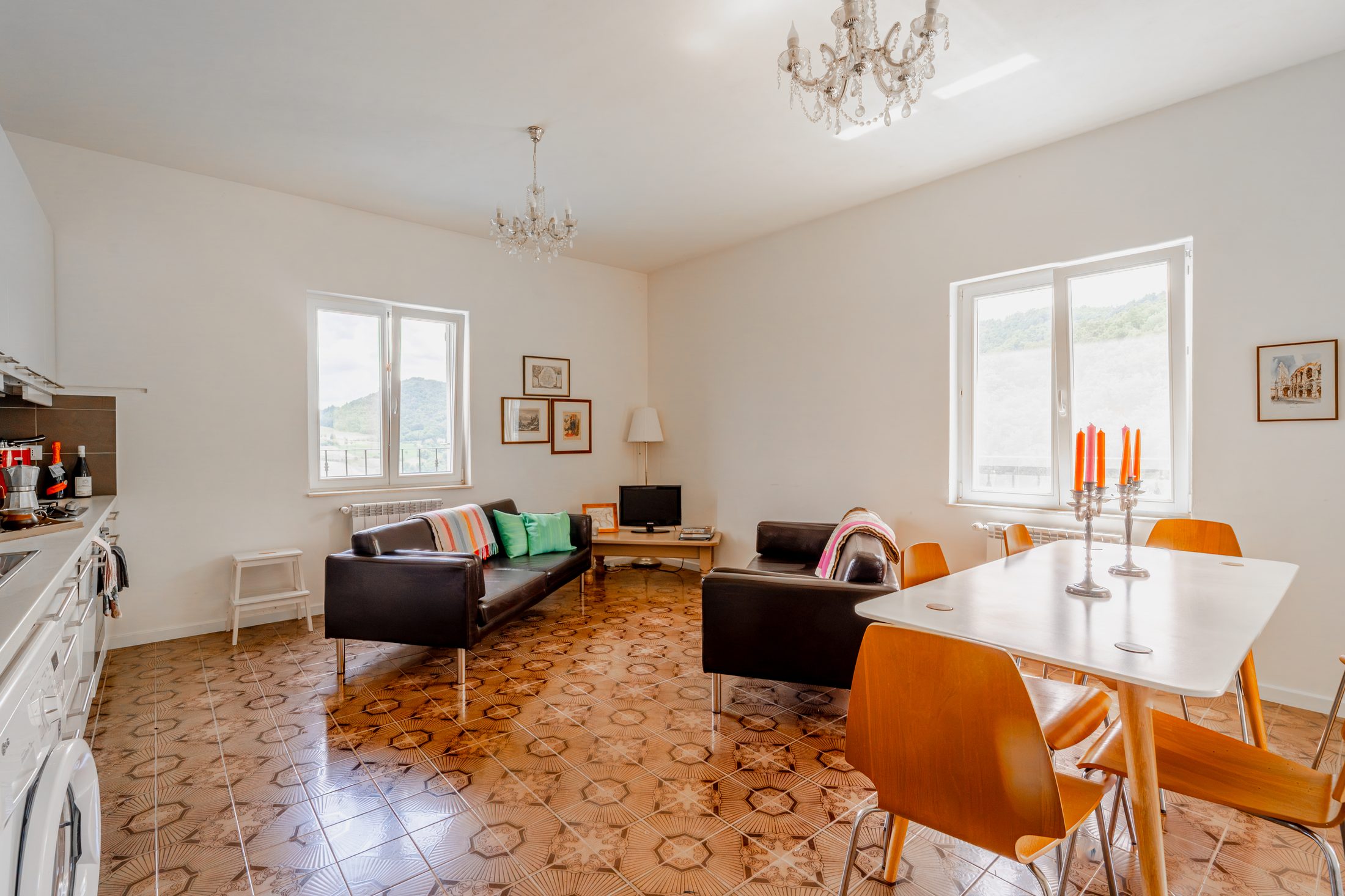 Open-plan kitchen, dining and living area in the apartment