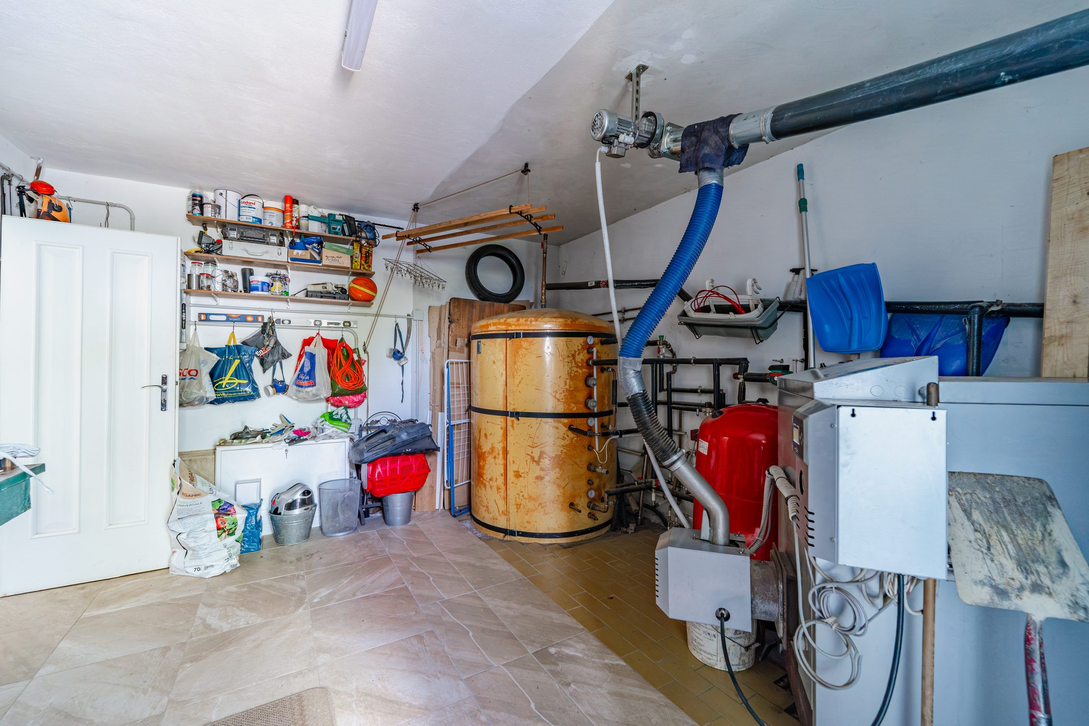 Workshop area with shelving, tools and equipment